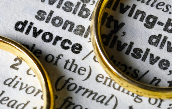 3 Common Questions Regarding Divorce - Two separate wedding rings next to the word