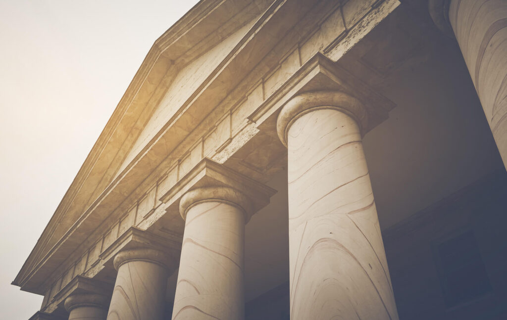 Columns of a courthouse where a Interpleader Litigation Lawyer works on cases