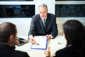 Business Succession Lawyer Missouri showing clients information on a clipboard
